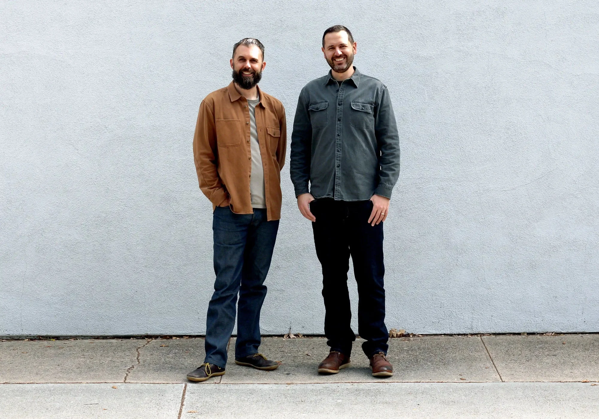 Tortuga co-founders Fred Perrotta and Jeremy Michael Cohen standing against a pale wall